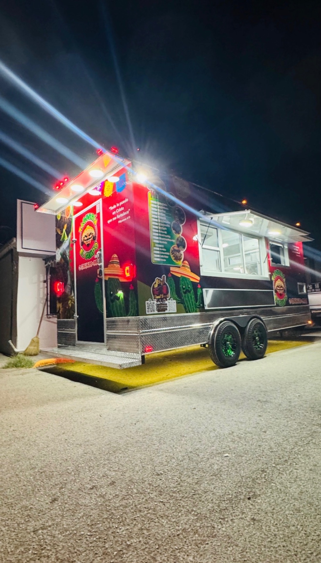 El Guapo trailer lit up at night