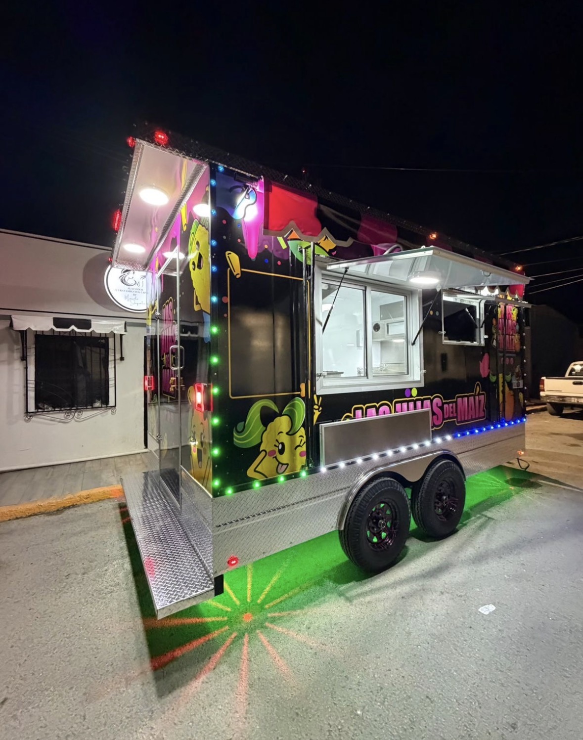 Las Hijas del Maiz custom wrapped food trailer at night